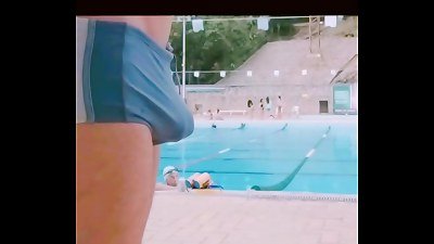 Pauzudo in swimming boxers at the club pool
