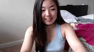 uber-cute chinese doll plays with her coochie