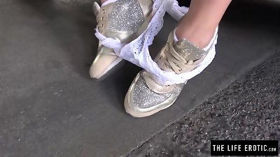 uber-cute girl jerks publicly in a parking garage