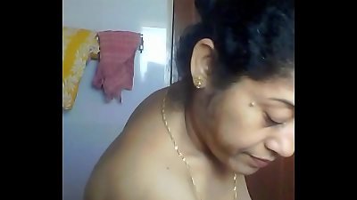 sexy older Indian aunt-in-law spied in bathroom by neighbour getting prepared for bath Part couple